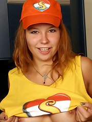 Busty young redhead toys her twat